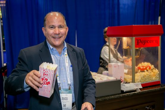 Attendee with Popcorn at the Expo Hall