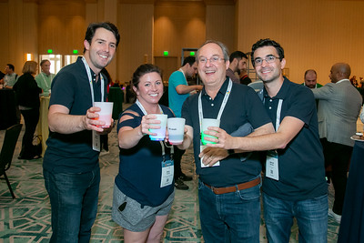 4 attendees standing and smiling at the Enterprise Connect Attendee Party