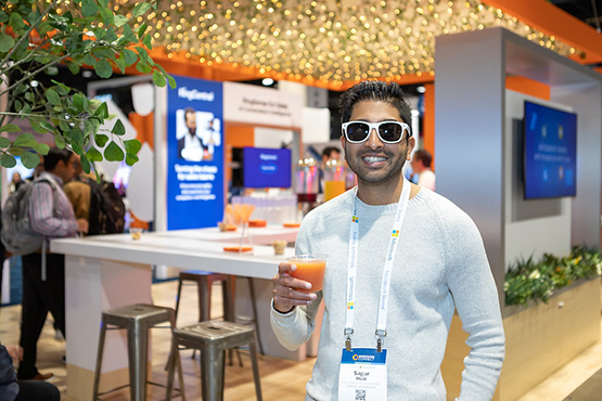Enterprise Connect attendee holding a refreshing glass of juice